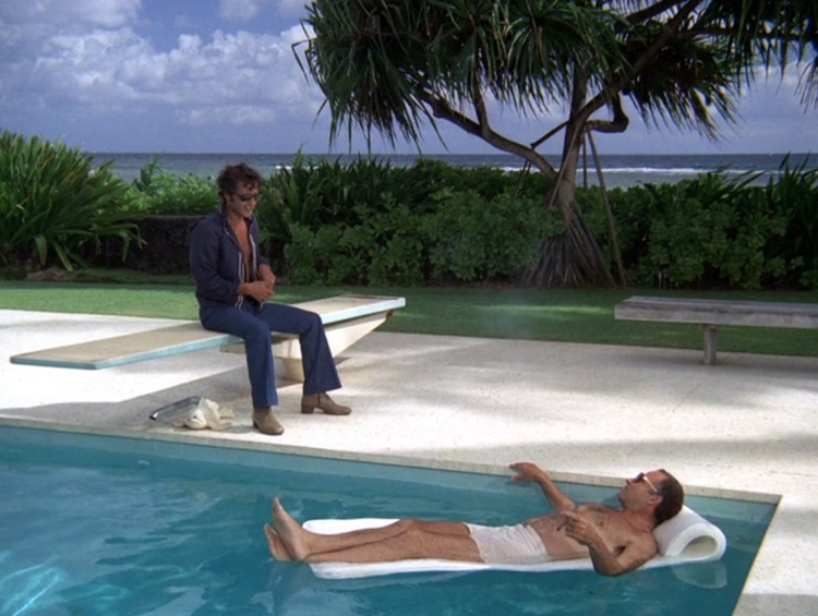 Sal Mineo as Eddie, a younger, tanned white man with curly dark hair, wearing, sunglasses jeans, brown boots, and blue shirt that's open to reveal his chest. He's sitting on a diving board. Nehemiah Persoff as Cordell, a middle aged tanned white man wearing sunglasses and white swim trunks. He's lounging in the pool on a white floatie.
